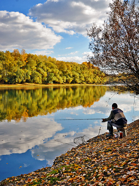 Man fishing on the bank of the Dniester River